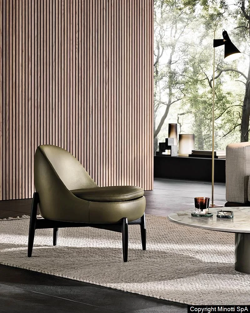 Design meubelen: Minotti Sendai fauteuil in groen lederen uitvoering op zwart essenhout onderstel