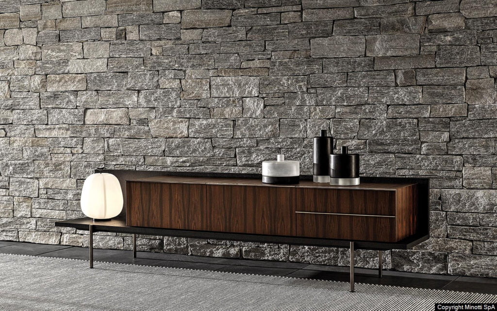 Minotti Superquadra kast sfeerfoto stenen muur santos palisander hout